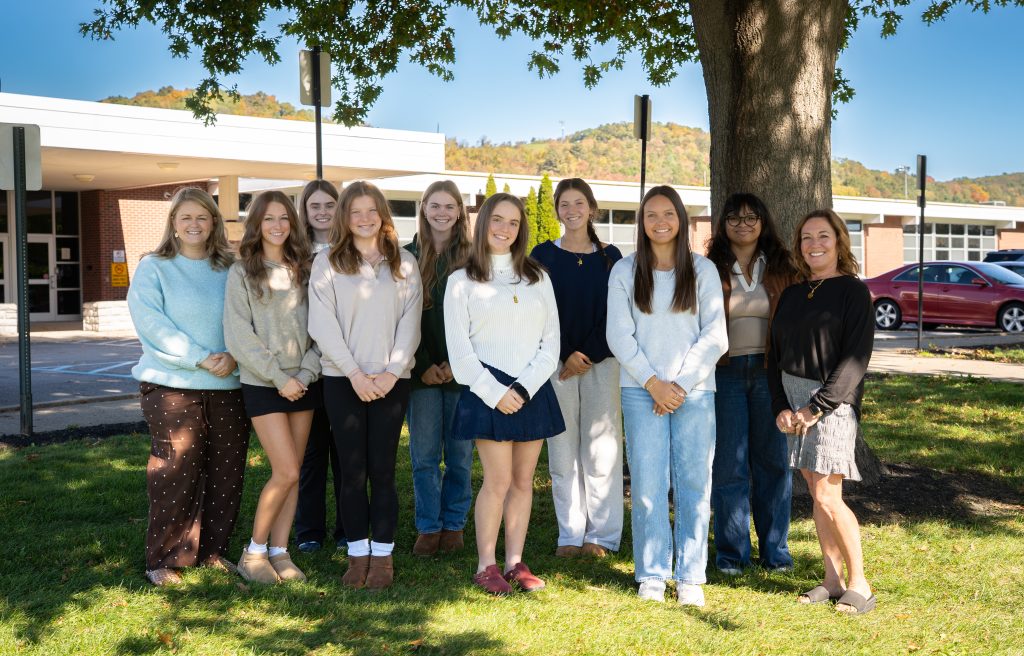The 2026 Women of Excellence nominees stand for a group photo in front of LTHS.